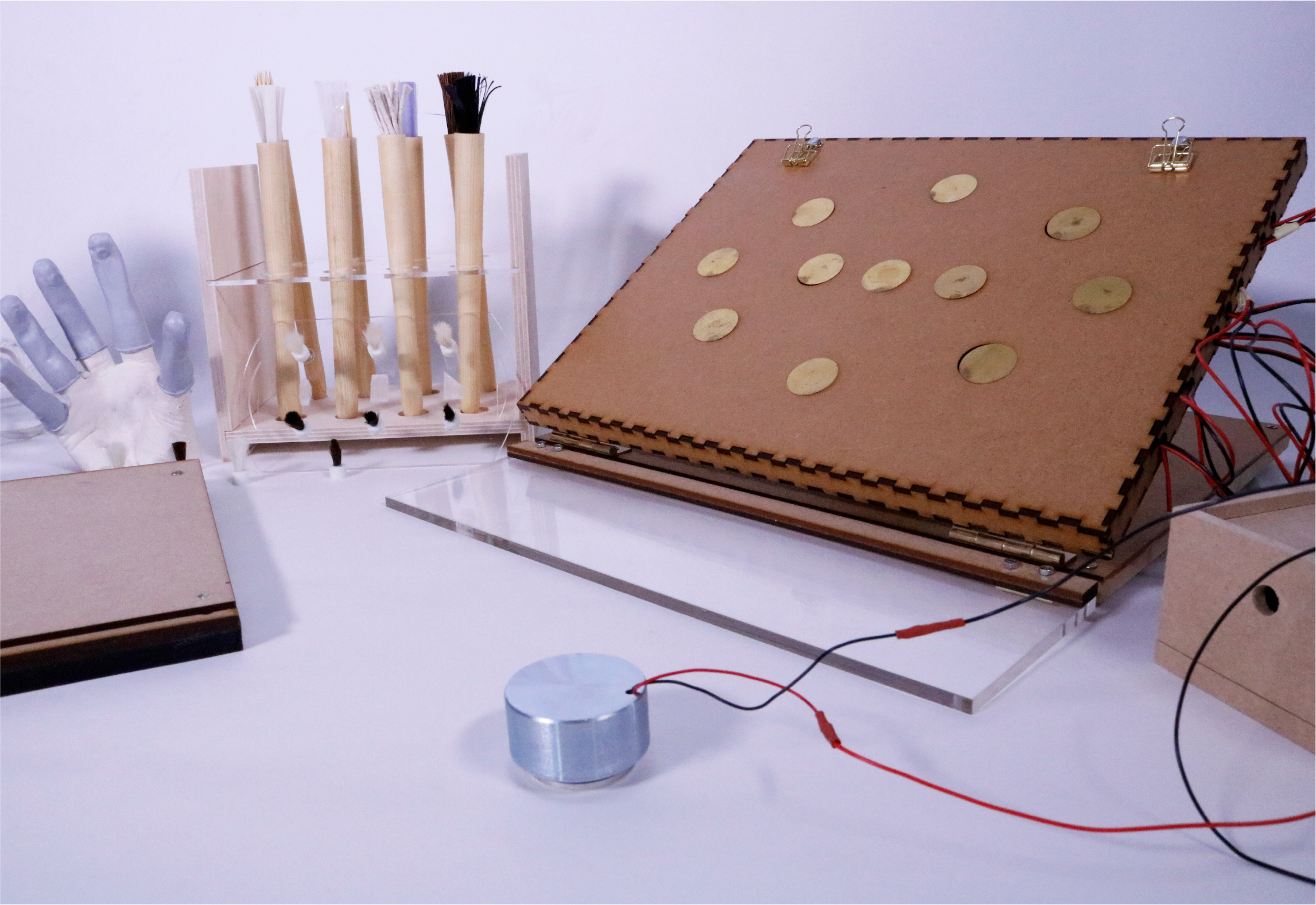 The EEP Kit tools that includes a painting board, finger brushes, a set of brushes, and a sound-enhancing easel, prototyped by Debbie Lim How
