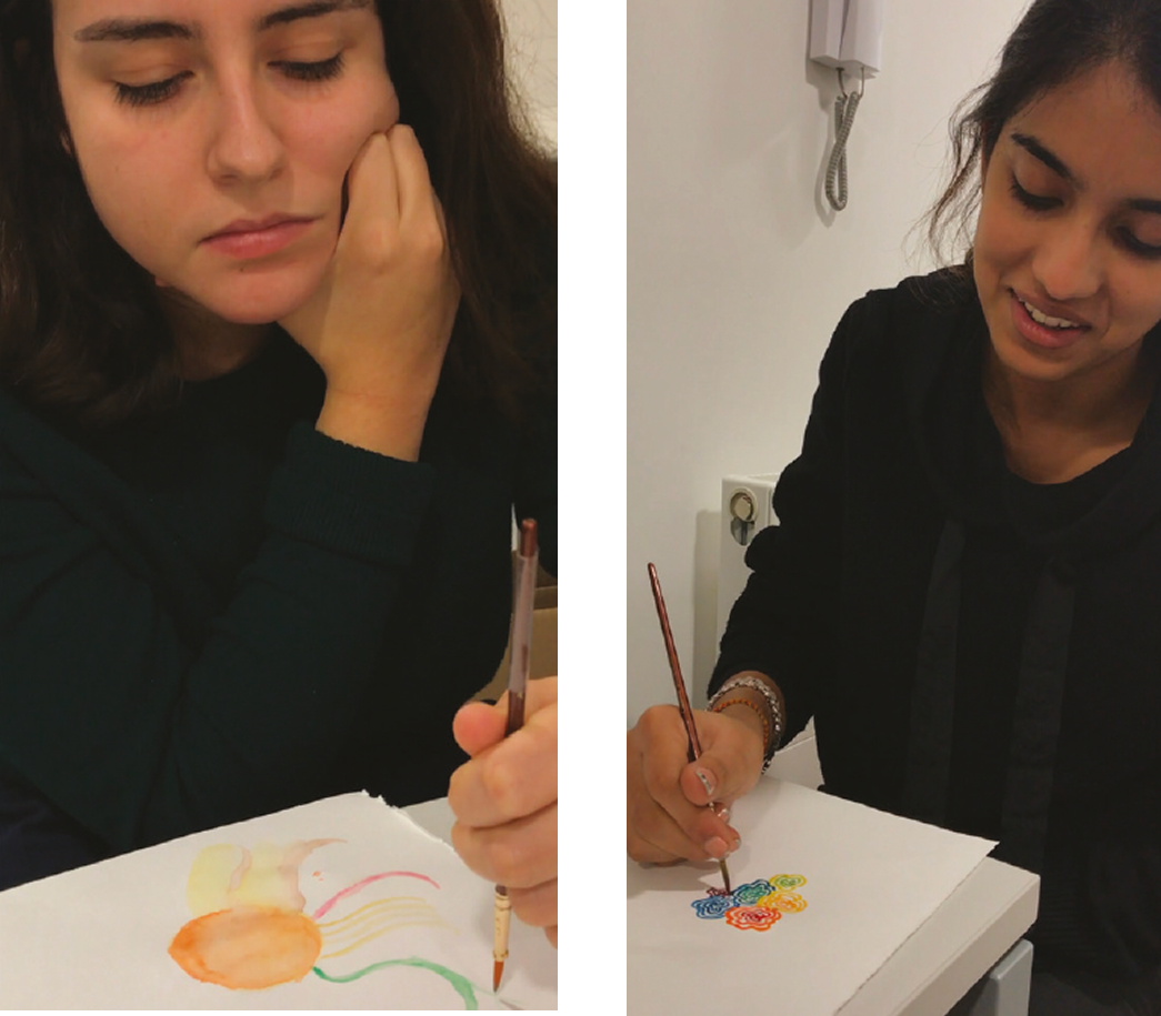 Two women painting